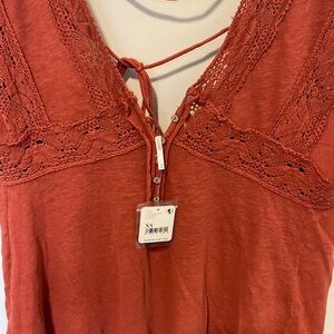 NWT Free People oversized top Beautiful crochet detail. Raw hem